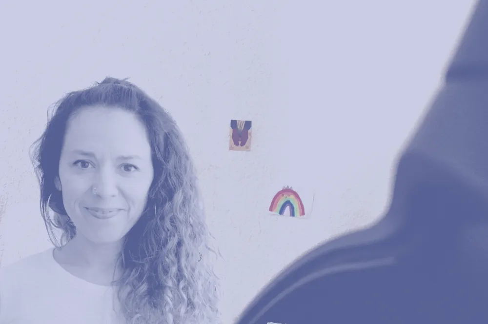 Viviana is smiling at the camera in front of a plain white background.